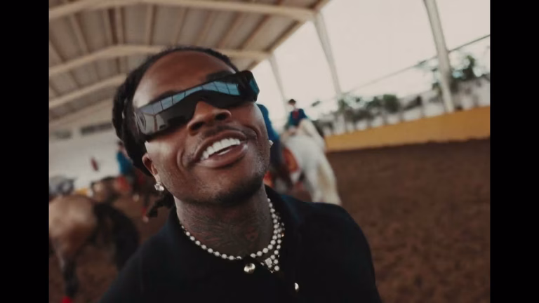 Gunna in 'HIM ALL ALONG' music video, featuring scenes in Atlanta and moments with fans and family