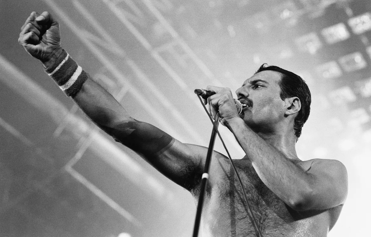 Freddie Mercury with Queen on stage during the 1980s