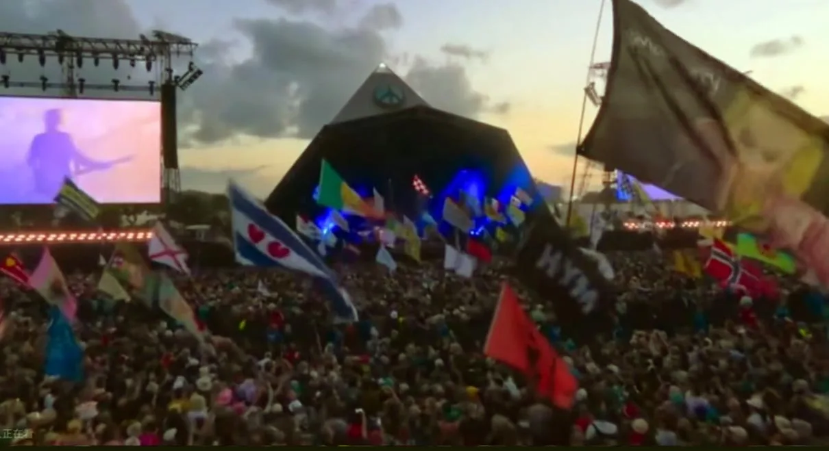 Crowd at Glastonbury Festival 2025 with Pyramid Stage in the background