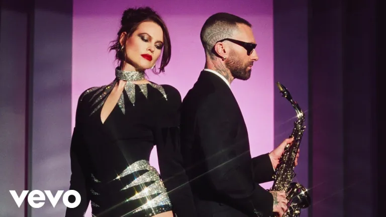 Maroon 5 performing “All Night” in vibrant summer music video