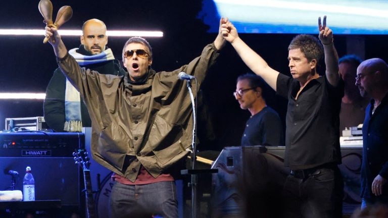 Liam and Noel Gallagher on stage at Wembley Stadium during the final UK shows of the 2025 Oasis reunion tour.