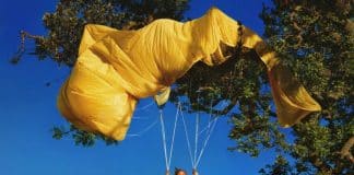 Doja Cat performing under neon lights, promoting Vie album