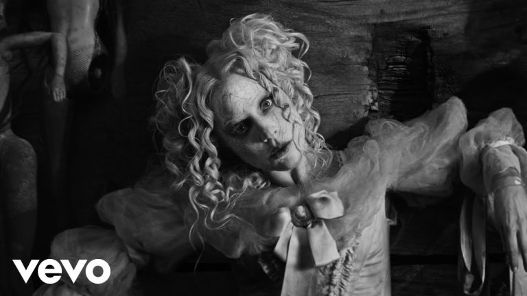 Lady Gaga as a cracked porcelain doll in The Dead Dance video