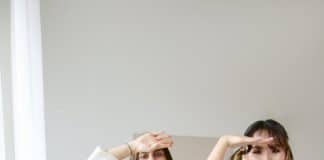 Young woman dancing while recording a TikTok video