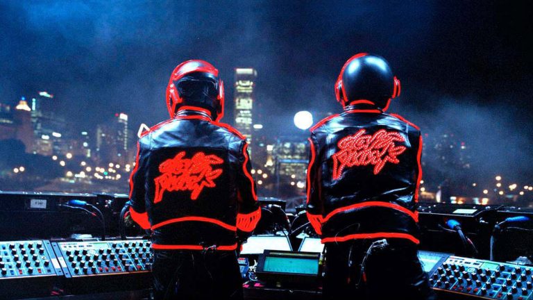 Daft Punk on stage wearing helmets, representing their Discovery legacy