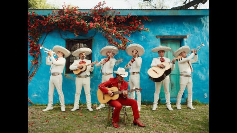 Bruno Mars performing with a mariachi band in the official music video for "Risk It All" from the album The Romantic.