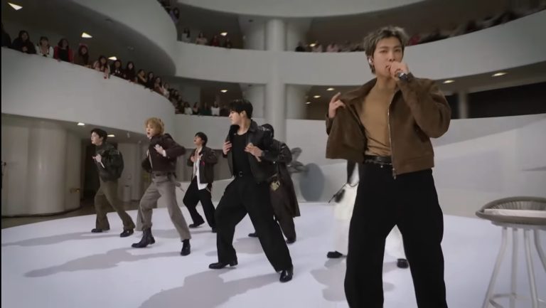 BTS members RM, Jin, Suga, J-Hope, Jimin, V, and Jung Kook performing "2.0" at the Guggenheim Museum for The Tonight Show
