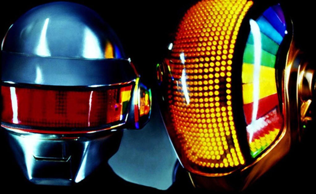 Daft Punk performing during the Discovery era in their classic robot helmets, a visual pioneered in the Interstella 5555 film.