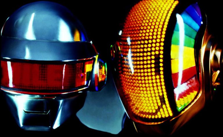 Daft Punk performing during the Discovery era in their classic robot helmets, a visual pioneered in the Interstella 5555 film.