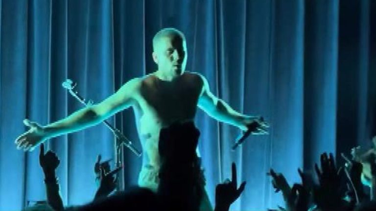 Justin Bieber performing shirtless at The Roxy in 2026, debuting new songs from his Swag and Swag II albums for an intimate crowd.