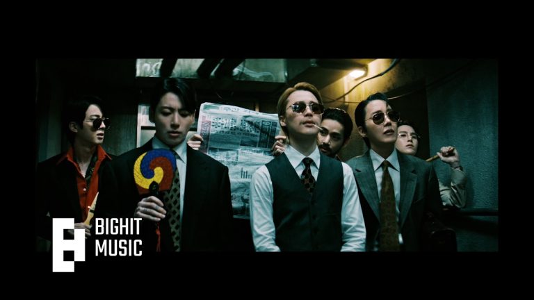 BTS members in dark, cinematic outfits for the "2.0" music video corridor scene.