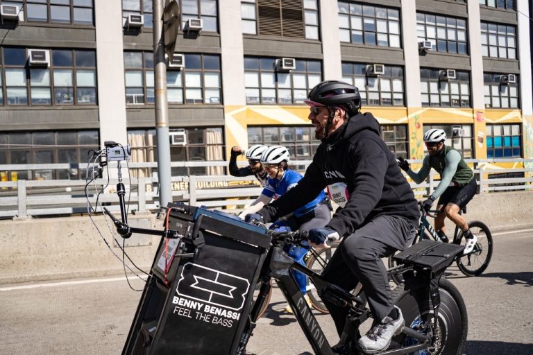 Benny Benassi cycling and DJing during the TD Five Boro Bike Tour in NYC.