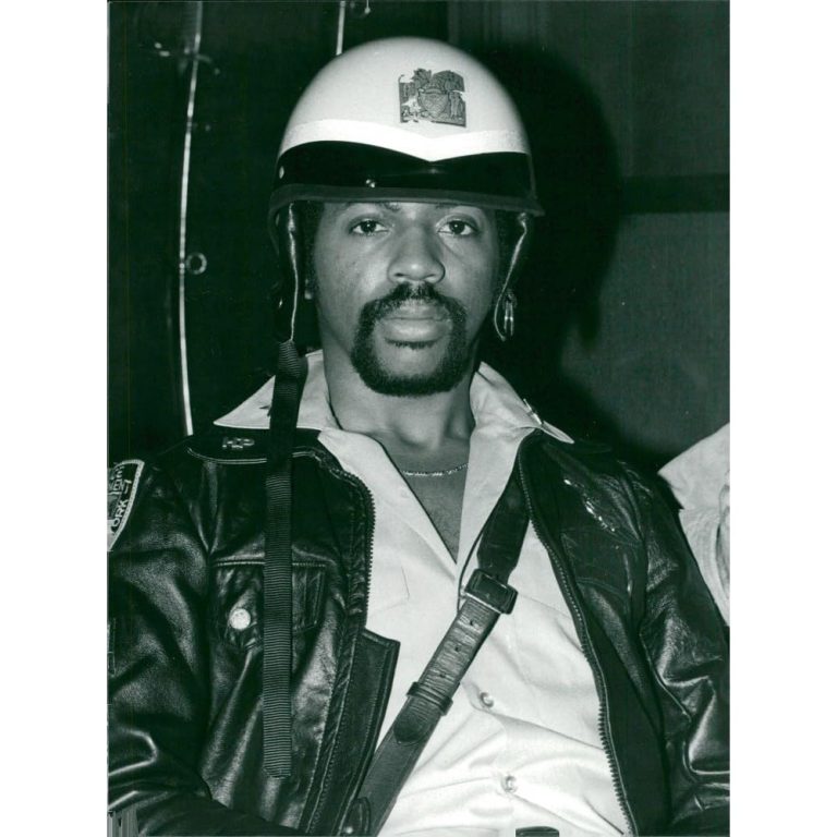 Victor Willis performing live in his iconic policeman uniform during the peak of the disco era with the Village People.
